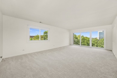 Perched on the top floor at the quiet corner of the building on Arlington Lakes Golf Club in Illinois - for sale on GolfHomes.com, golf home, golf lot