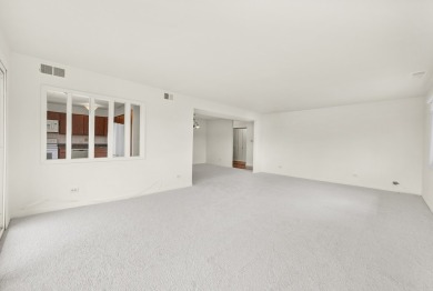 Perched on the top floor at the quiet corner of the building on Arlington Lakes Golf Club in Illinois - for sale on GolfHomes.com, golf home, golf lot