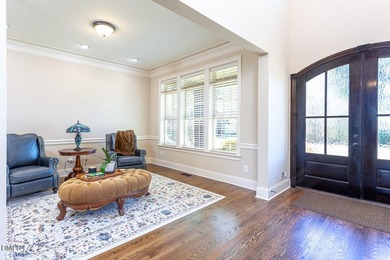 Designed for those who appreciate space with intention, this on Hasentree Club in North Carolina - for sale on GolfHomes.com, golf home, golf lot