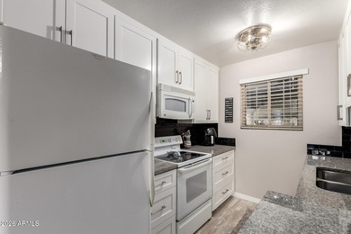 Beautifully updated 2-bedroom, 2-bath condo in the highly on Country Meadows Golf Club in Arizona - for sale on GolfHomes.com, golf home, golf lot