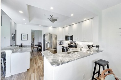 Welcome to effortless living in Palm Colony at Pelican Landing on The Colony Golf and Country Club in Florida - for sale on GolfHomes.com, golf home, golf lot