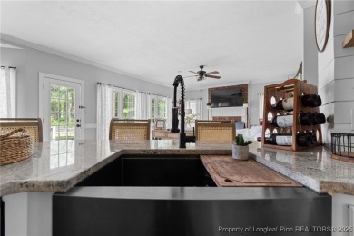 Welcome to your dream home on the scenic Kings Grant Golf Course on Kings Grant Golf and Country Club in North Carolina - for sale on GolfHomes.com, golf home, golf lot