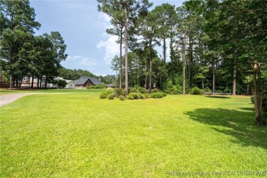 Welcome to your dream home on the scenic Kings Grant Golf Course on Kings Grant Golf and Country Club in North Carolina - for sale on GolfHomes.com, golf home, golf lot