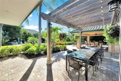 Welcome to effortless living in Palm Colony at Pelican Landing on The Colony Golf and Country Club in Florida - for sale on GolfHomes.com, golf home, golf lot