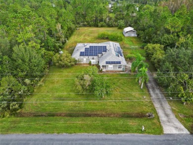 Under contract-accepting backup offers. Set on over an acre in on Wedgefield Golf Club in Florida - for sale on GolfHomes.com, golf home, golf lot