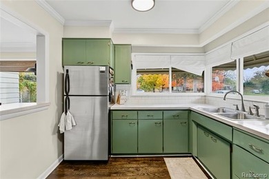 Enjoy a beautiful blend of comfort and character with this on Kearsley Lake Golf Course in Michigan - for sale on GolfHomes.com, golf home, golf lot