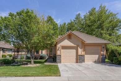 Nestled in a gated golf course community and overlooking serene on Genoa Lakes Golf Club - Lakes Course in Nevada - for sale on GolfHomes.com, golf home, golf lot