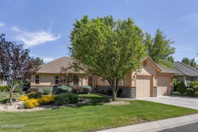 Nestled in a gated golf course community and overlooking serene on Genoa Lakes Golf Club - Lakes Course in Nevada - for sale on GolfHomes.com, golf home, golf lot