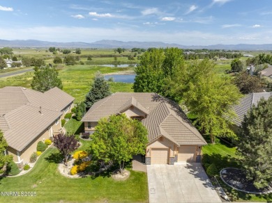 Nestled in a gated golf course community and overlooking serene on Genoa Lakes Golf Club - Lakes Course in Nevada - for sale on GolfHomes.com, golf home, golf lot