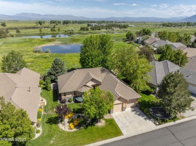 Nestled in a gated golf course community and overlooking serene on Genoa Lakes Golf Club - Lakes Course in Nevada - for sale on GolfHomes.com, golf home, golf lot