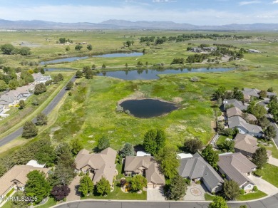 Nestled in a gated golf course community and overlooking serene on Genoa Lakes Golf Club - Lakes Course in Nevada - for sale on GolfHomes.com, golf home, golf lot