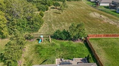 Welcome to comfort and style in this charming 1.5-story reverse on Prairie Highlands Golf Course in Kansas - for sale on GolfHomes.com, golf home, golf lot