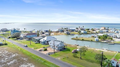 Coastal charm meets waterfront living in this beautifully on Rockport Country Club in Texas - for sale on GolfHomes.com, golf home, golf lot