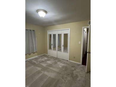 Welcome home to this charming 3-bedroom residence nestled in a on Lake Erie Metropark Golf Course in Michigan - for sale on GolfHomes.com, golf home, golf lot