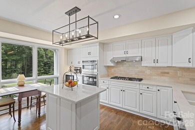 Absolutely Exceptional Freestanding Villa on the 16th Fairway in on Kenmure Country Club in North Carolina - for sale on GolfHomes.com, golf home, golf lot