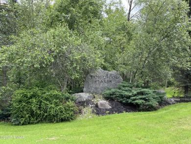 This property is sloping from the street down to the back on Paupack Hills Golf and Country Club in Pennsylvania - for sale on GolfHomes.com, golf home, golf lot