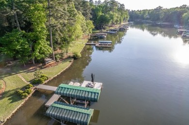 Welcome to your dream lakefront retreat in the prestigious on Reynolds Lake Oconee - The Plantation in Georgia - for sale on GolfHomes.com, golf home, golf lot