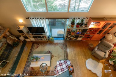 Welcome to this distinctive four-bedroom, three-bath chalet on Canadian Lakes Country Club-The Royal Course in Michigan - for sale on GolfHomes.com, golf home, golf lot