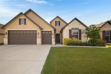 Beautifully landscaped single-story home with an inviting open on Wildhorse Golf Club of Robson Ranch in Texas - for sale on GolfHomes.com, golf home, golf lot