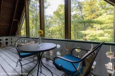 Welcome to this distinctive four-bedroom, three-bath chalet on Canadian Lakes Country Club-The Royal Course in Michigan - for sale on GolfHomes.com, golf home, golf lot