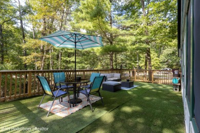 Welcome to this distinctive four-bedroom, three-bath chalet on Canadian Lakes Country Club-The Royal Course in Michigan - for sale on GolfHomes.com, golf home, golf lot