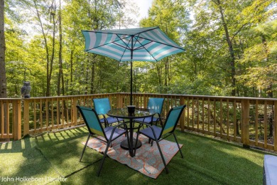 Welcome to this distinctive four-bedroom, three-bath chalet on Canadian Lakes Country Club-The Royal Course in Michigan - for sale on GolfHomes.com, golf home, golf lot