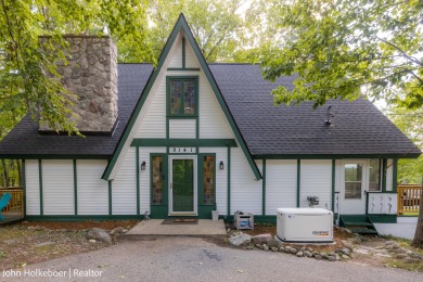 Welcome to this distinctive four-bedroom, three-bath chalet on Canadian Lakes Country Club-The Royal Course in Michigan - for sale on GolfHomes.com, golf home, golf lot