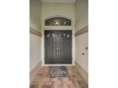 Look forward to coming home! Live on a quiet street in Eastlake on East Lake Woodlands Country Club in Florida - for sale on GolfHomes.com, golf home, golf lot