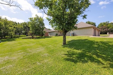 Welcome to this beautifully maintained 4-bedroom, 2-bathroom on Pecan Plantation Country Club in Texas - for sale on GolfHomes.com, golf home, golf lot