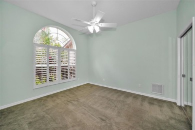 Look forward to coming home! Live on a quiet street in Eastlake on East Lake Woodlands Country Club in Florida - for sale on GolfHomes.com, golf home, golf lot