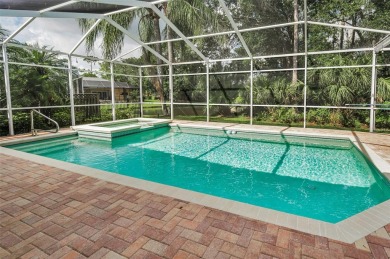 Look forward to coming home! Live on a quiet street in Eastlake on East Lake Woodlands Country Club in Florida - for sale on GolfHomes.com, golf home, golf lot