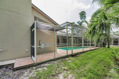 Look forward to coming home! Live on a quiet street in Eastlake on East Lake Woodlands Country Club in Florida - for sale on GolfHomes.com, golf home, golf lot