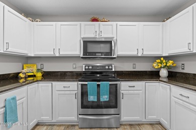 This exceptionally spacious brick townhome offers over 1,900 on Masonboro Country Club in North Carolina - for sale on GolfHomes.com, golf home, golf lot