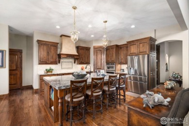This custom ranch home on a stunning waterfront lot offers an on Pelican Lakes Golf and Country Club in Colorado - for sale on GolfHomes.com, golf home, golf lot