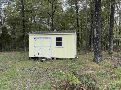 This property sits on 3 spacious lots with mature trees offering on The Course At Turkey Mountain in Arkansas - for sale on GolfHomes.com, golf home, golf lot