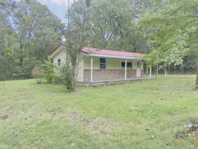 This property sits on 3 spacious lots with mature trees offering on The Course At Turkey Mountain in Arkansas - for sale on GolfHomes.com, golf home, golf lot