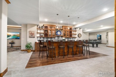 This custom ranch home on a stunning waterfront lot offers an on Pelican Lakes Golf and Country Club in Colorado - for sale on GolfHomes.com, golf home, golf lot