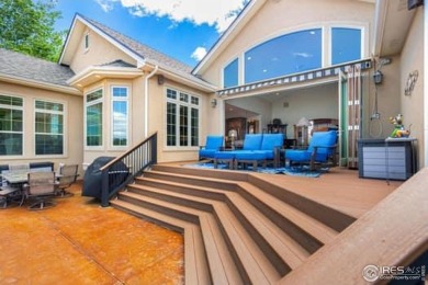 This custom ranch home on a stunning waterfront lot offers an on Pelican Lakes Golf and Country Club in Colorado - for sale on GolfHomes.com, golf home, golf lot