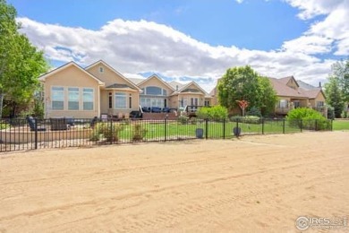 This custom ranch home on a stunning waterfront lot offers an on Pelican Lakes Golf and Country Club in Colorado - for sale on GolfHomes.com, golf home, golf lot