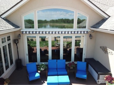 This custom ranch home on a stunning waterfront lot offers an on Pelican Lakes Golf and Country Club in Colorado - for sale on GolfHomes.com, golf home, golf lot