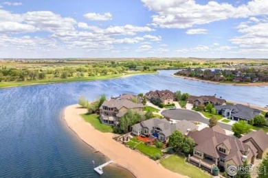This custom ranch home on a stunning waterfront lot offers an on Pelican Lakes Golf and Country Club in Colorado - for sale on GolfHomes.com, golf home, golf lot