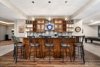 This custom ranch home on a stunning waterfront lot offers an on Pelican Lakes Golf and Country Club in Colorado - for sale on GolfHomes.com, golf home, golf lot