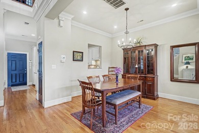 Handsome townhome tucked behind the 15th green of Raintree's on Raintree Country Club in North Carolina - for sale on GolfHomes.com, golf home, golf lot