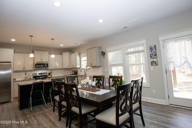 Built in 2023 and located inside the gated Woodlake community on Woodlake Country Club in North Carolina - for sale on GolfHomes.com, golf home, golf lot