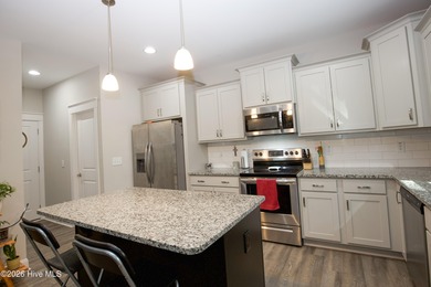 Built in 2023 and located inside the gated Woodlake community on Woodlake Country Club in North Carolina - for sale on GolfHomes.com, golf home, golf lot