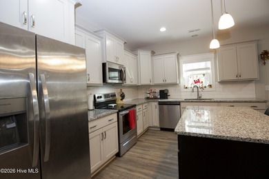 Built in 2023 and located inside the gated Woodlake community on Woodlake Country Club in North Carolina - for sale on GolfHomes.com, golf home, golf lot