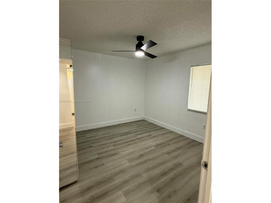 Bright & spacious updated condo 2 bedroom & 1.5 bath located in on Flamingo Lakes Country Club in Florida - for sale on GolfHomes.com, golf home, golf lot