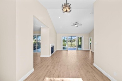 Reimagined and move-in ready, this waterfront home on an on The Legacy Golf and Tennis Club in Florida - for sale on GolfHomes.com, golf home, golf lot