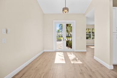 Reimagined and move-in ready, this waterfront home on an on The Legacy Golf and Tennis Club in Florida - for sale on GolfHomes.com, golf home, golf lot