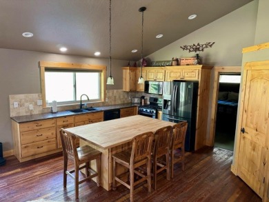 Exceptional custom-built home on over 6 acres, bordered by tens on Double Arrow Lodge in Montana - for sale on GolfHomes.com, golf home, golf lot